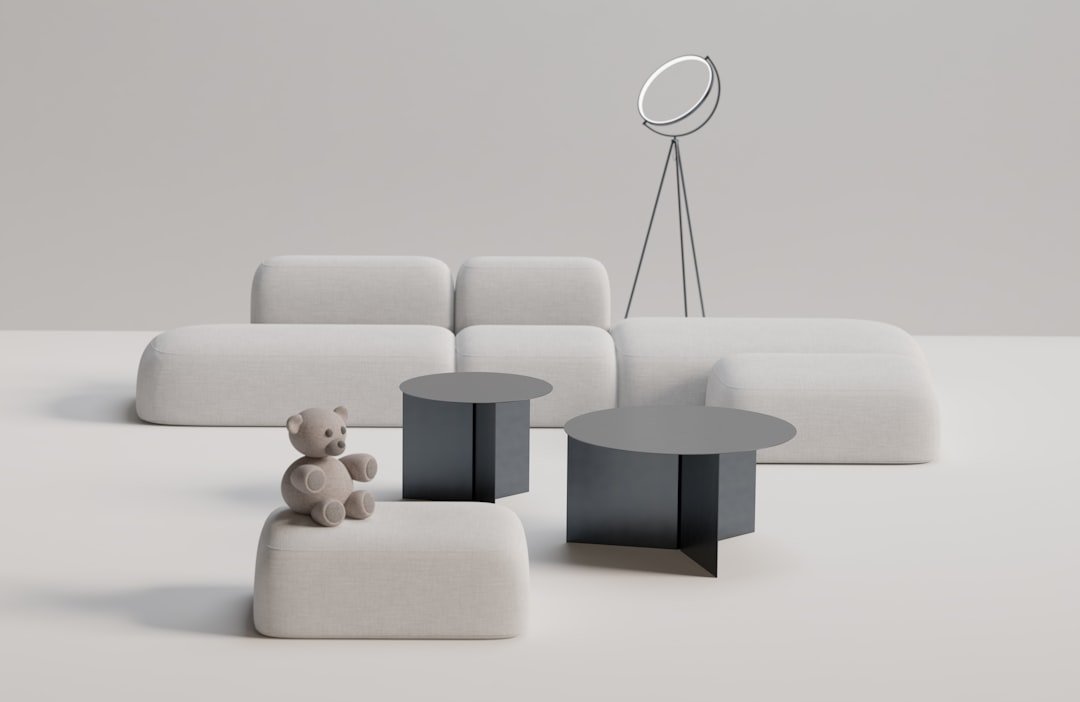a teddy bear sitting on a stool in a room