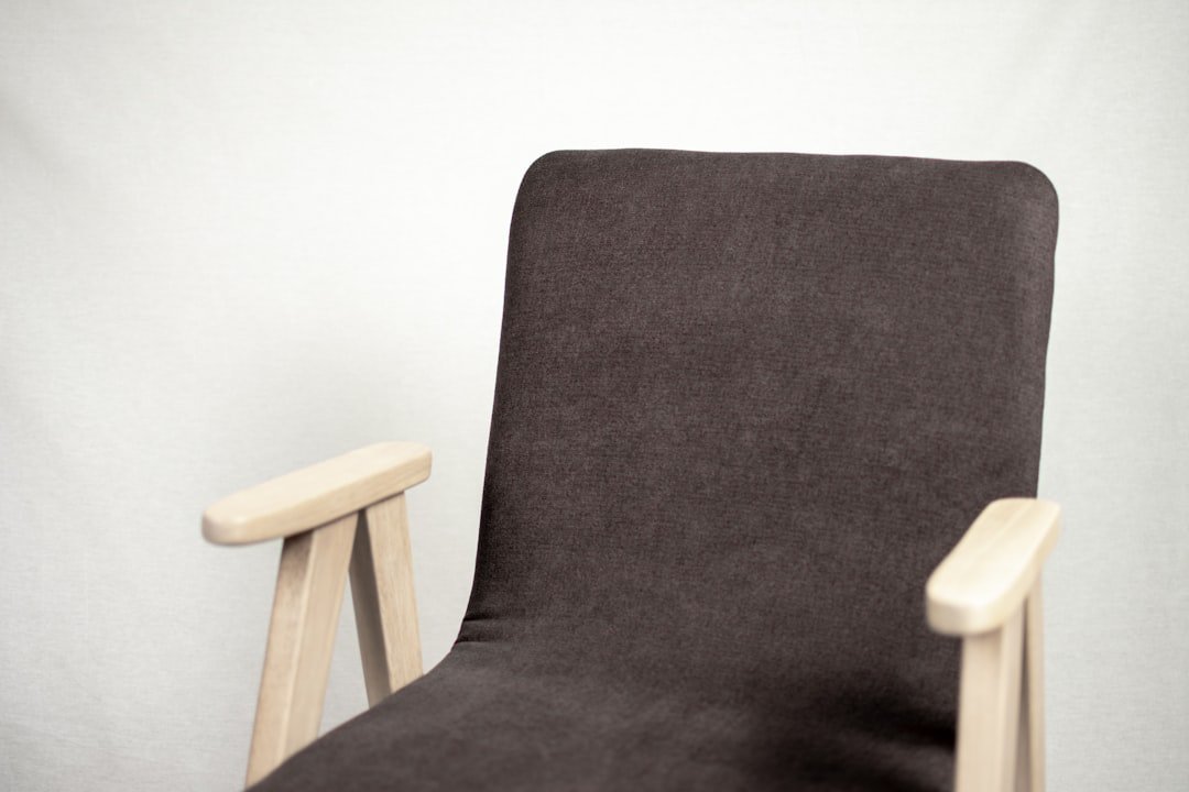 black and gray padded armchair