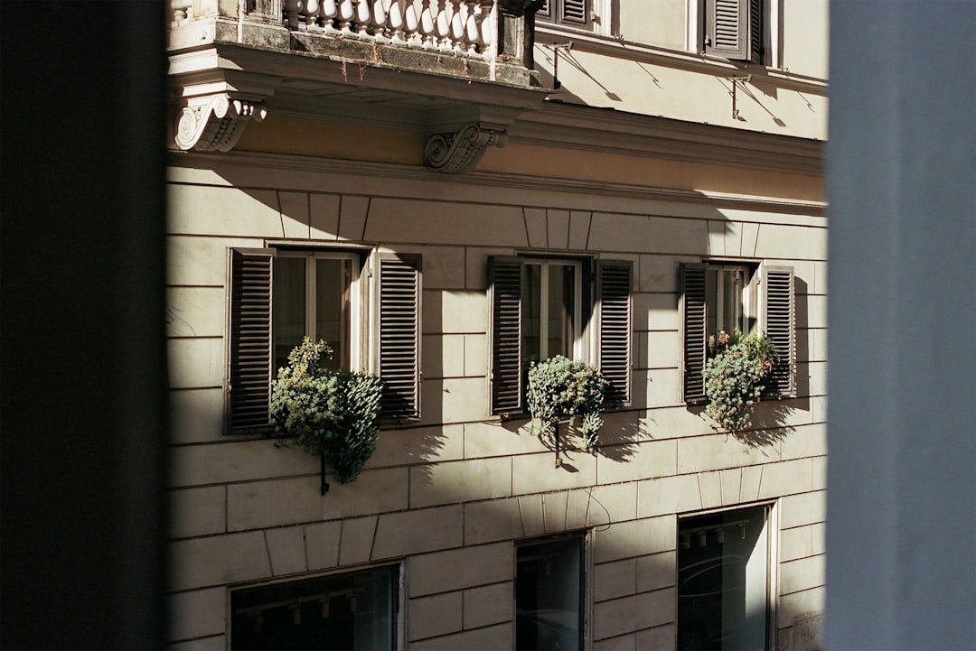 A building with a bunch of windows and a balcony