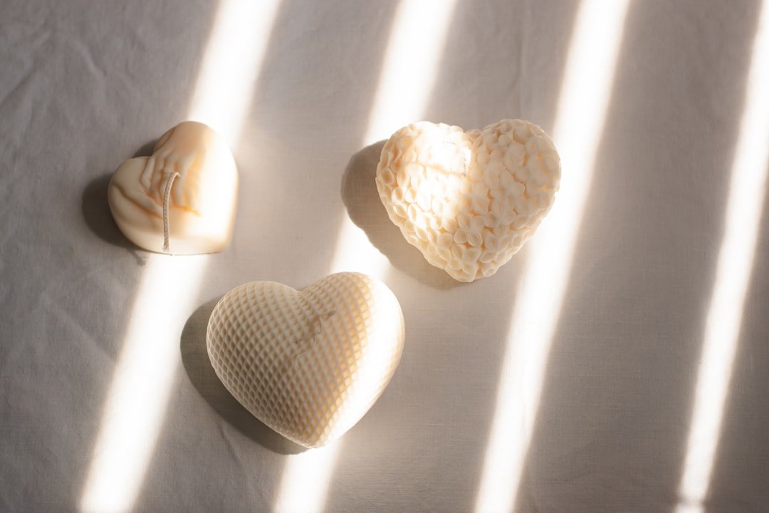 Three heart shaped soaps on a white sheet