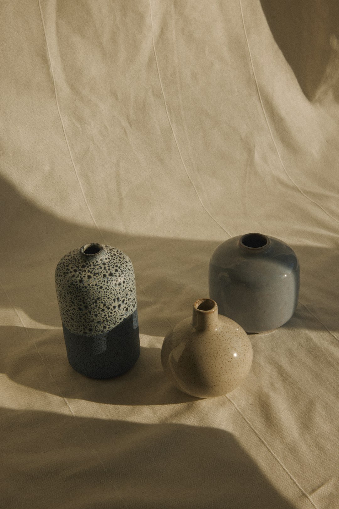 a couple of vases sitting on top of a table