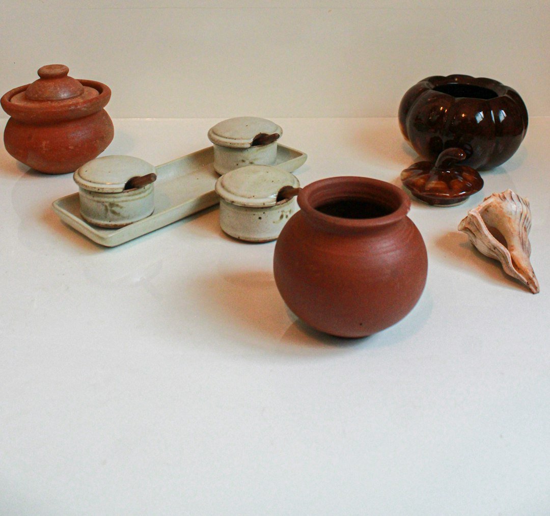 brown and white ceramic jars