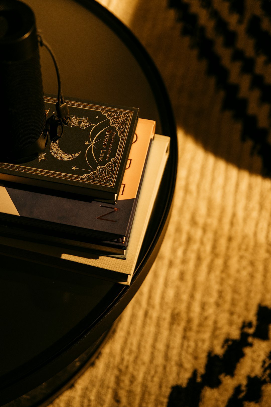a stack of books sitting on top of a table