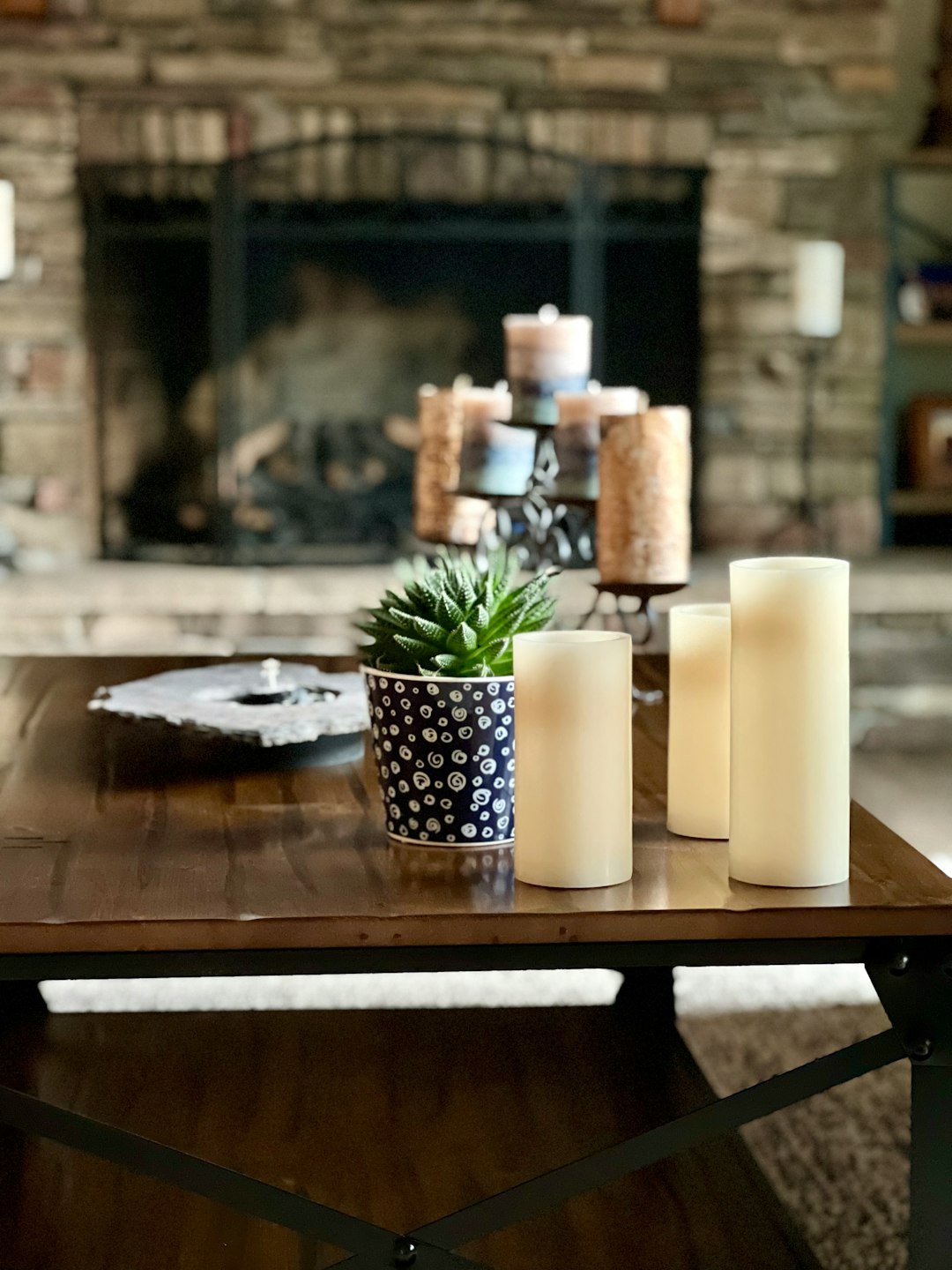 a table with candles and a plant
