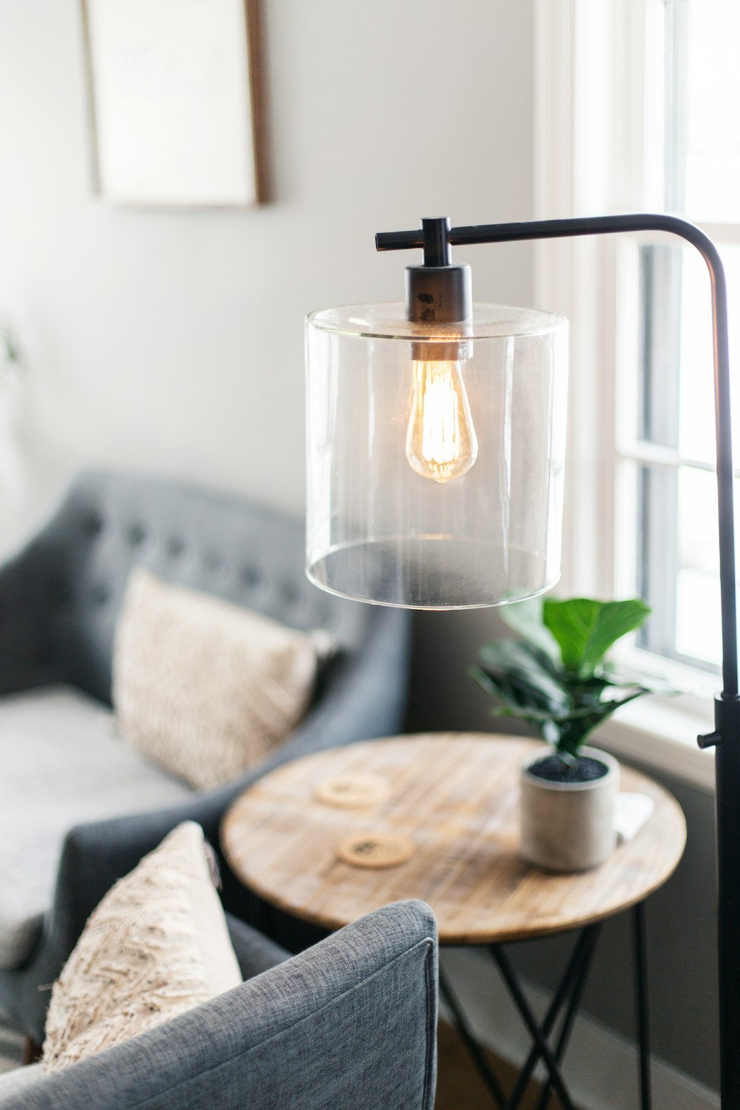 clear glass lamp on table