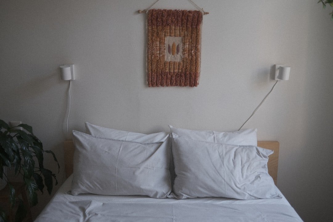 a bed with white pillows