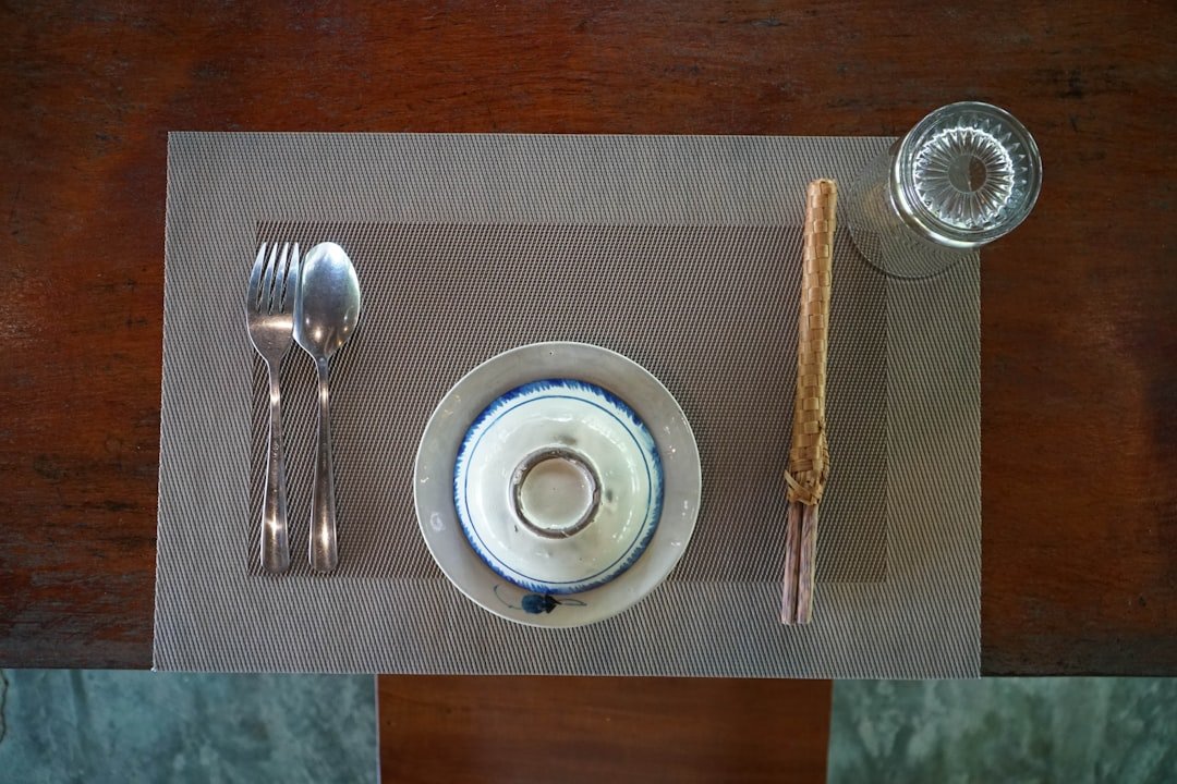 a plate with a spoon and a bowl on it