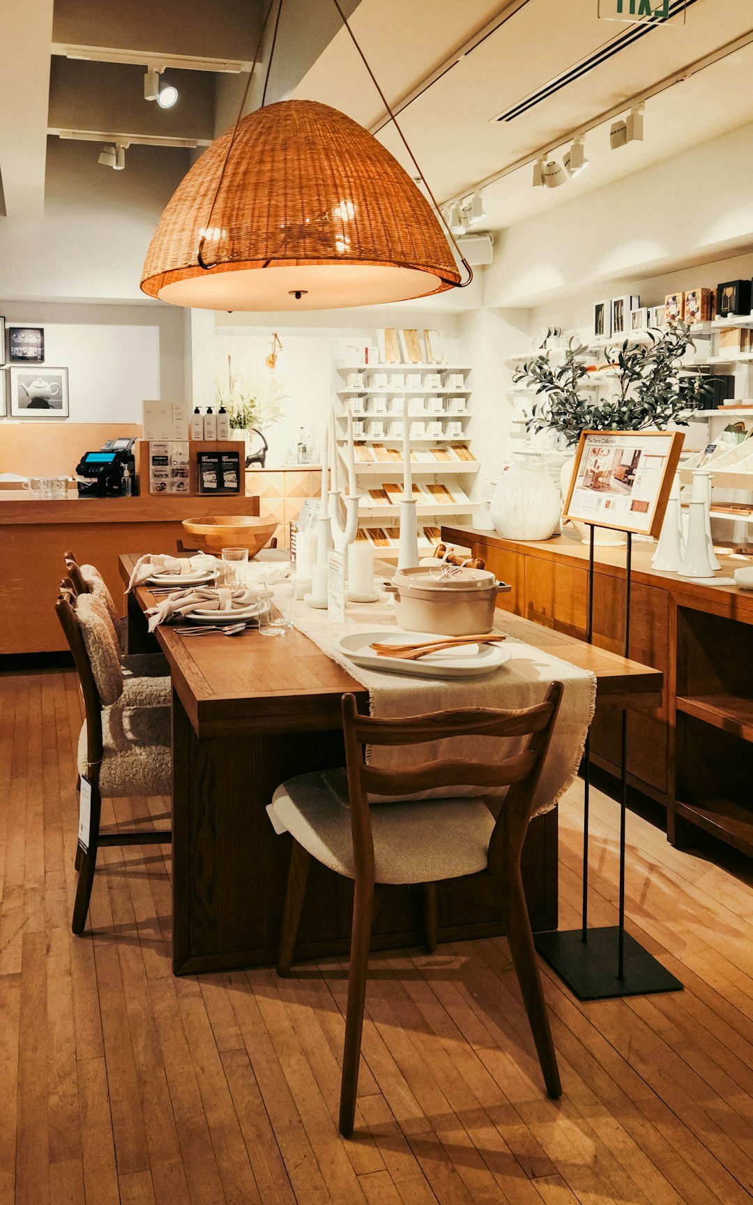 A dining room with a wooden table and chairs