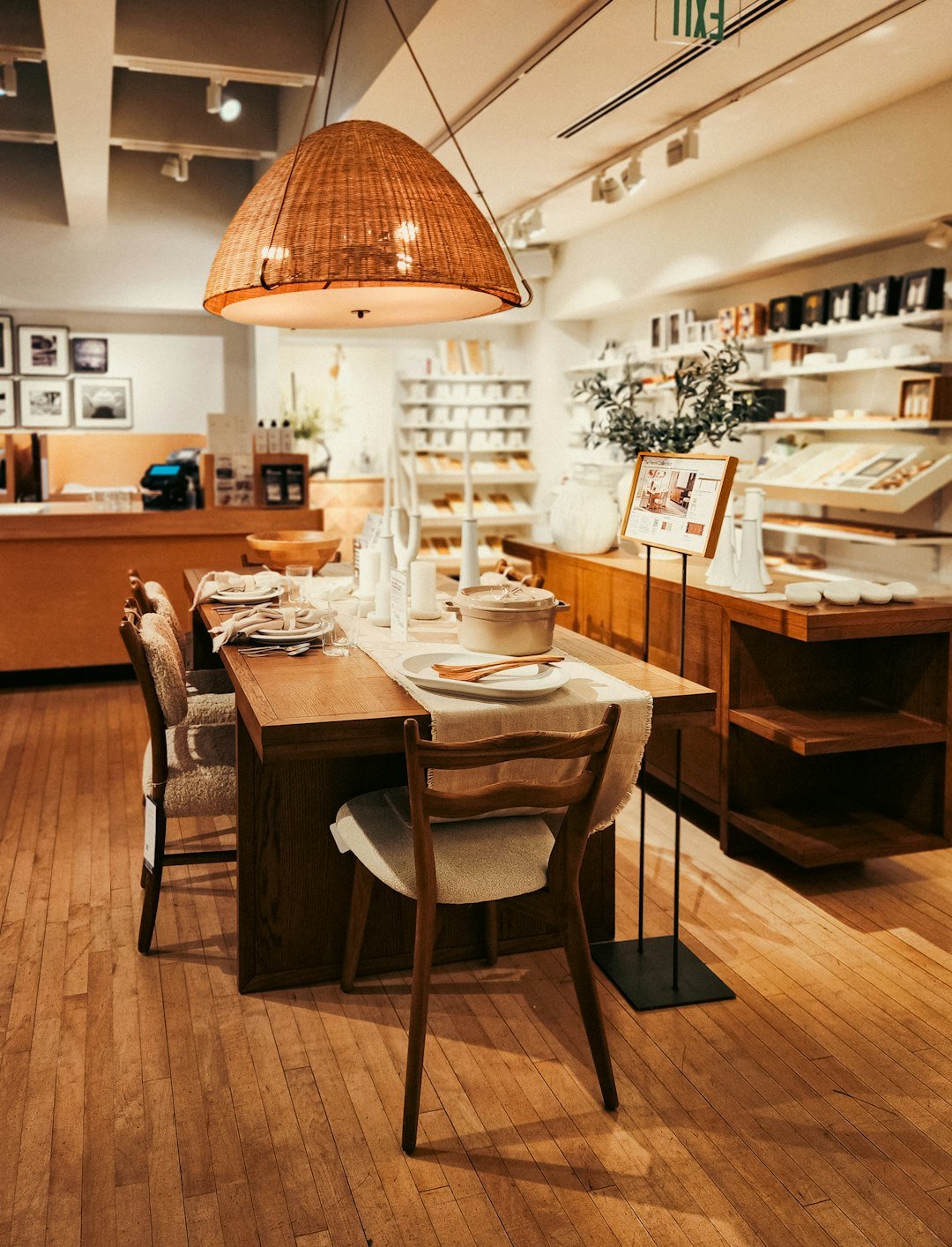 A dining room with a wooden table and chairs