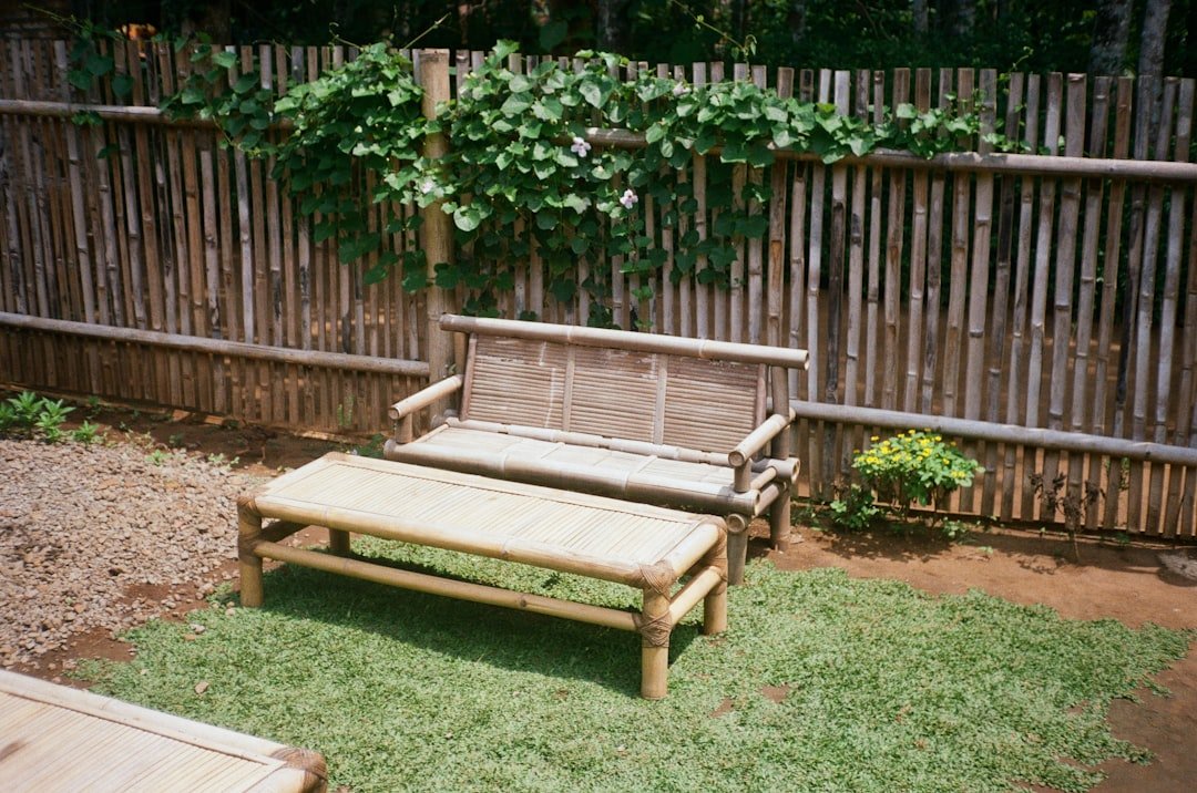 a wooden bench sitting next to a wooden bench
