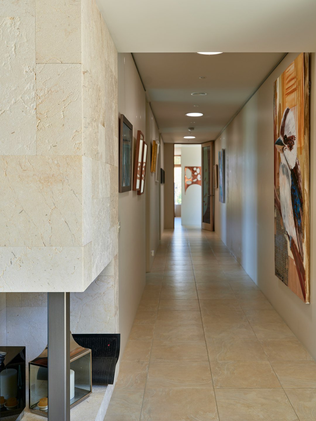 A long hallway with paintings on the wall