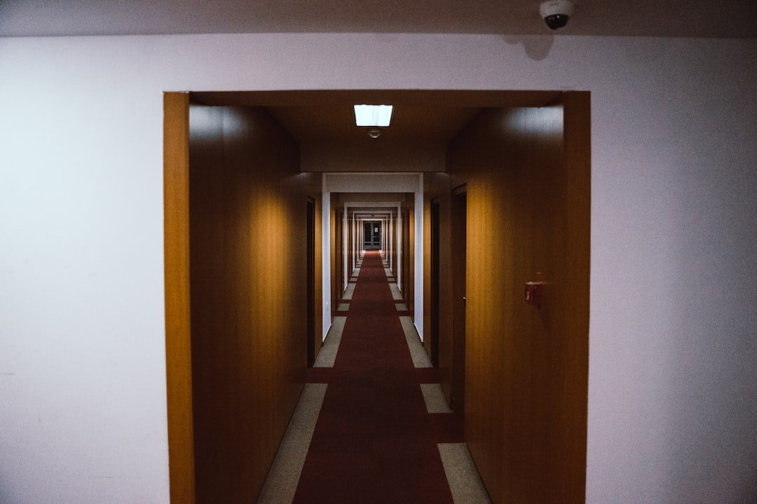 brown wooden door on white painted wall
