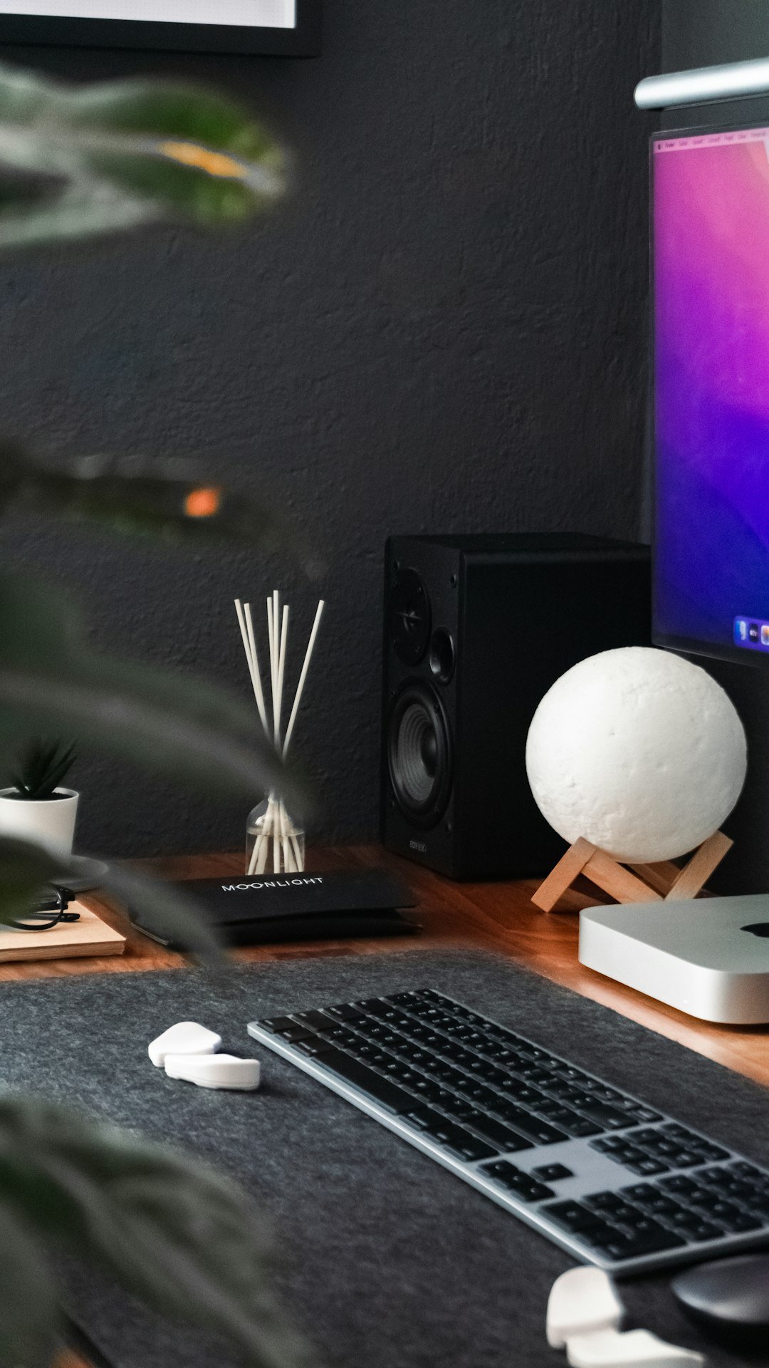 a desk with a computer and a keyboard
