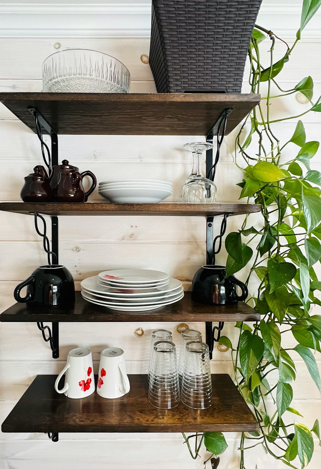 a shelf with plates and cups on it