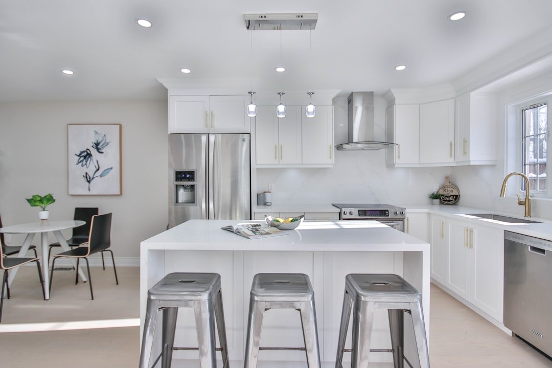 a kitchen with a center island with stools