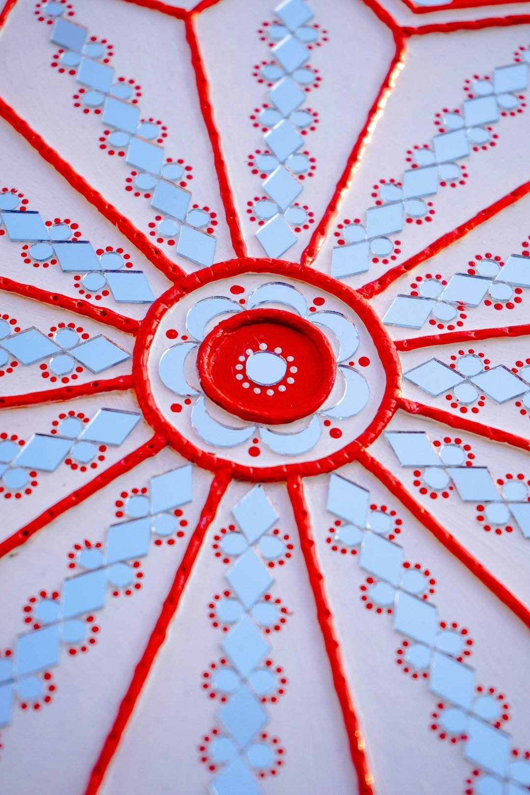 A close up of a red and white umbrella