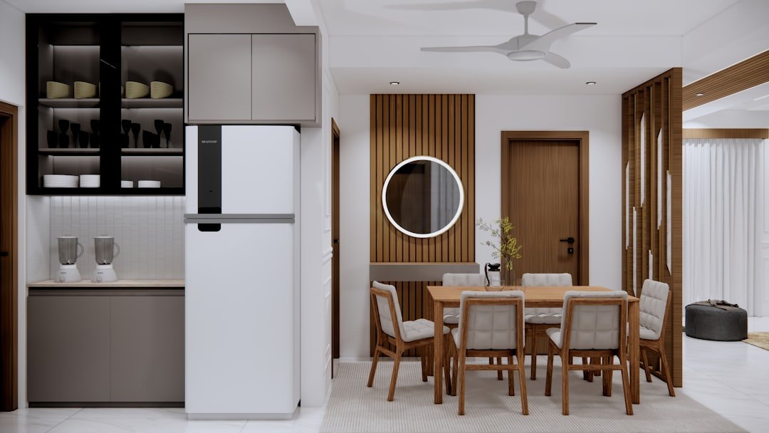 A kitchen and dining room with a ceiling fan
