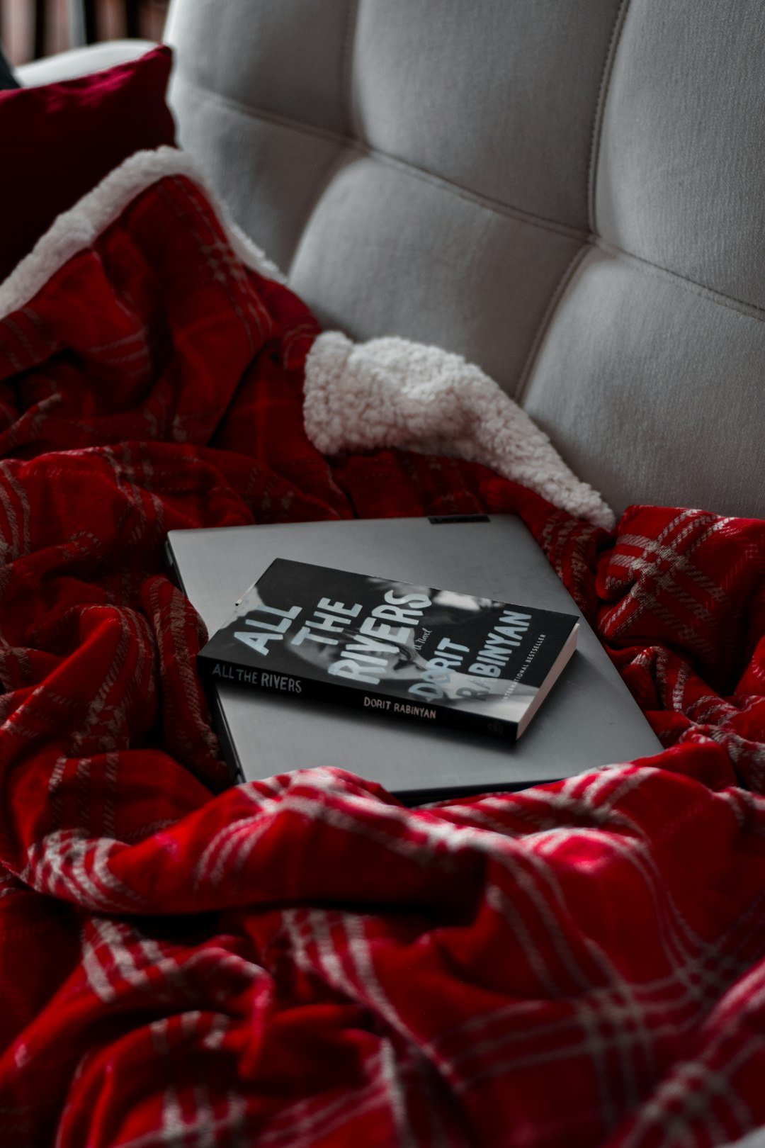 black book on red and white textile