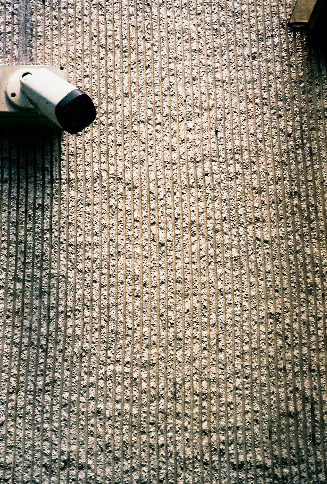 white and black tube bottle on gray textile