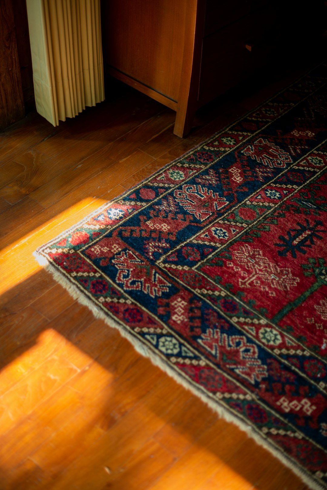 A wooden floor with a rug on top of it