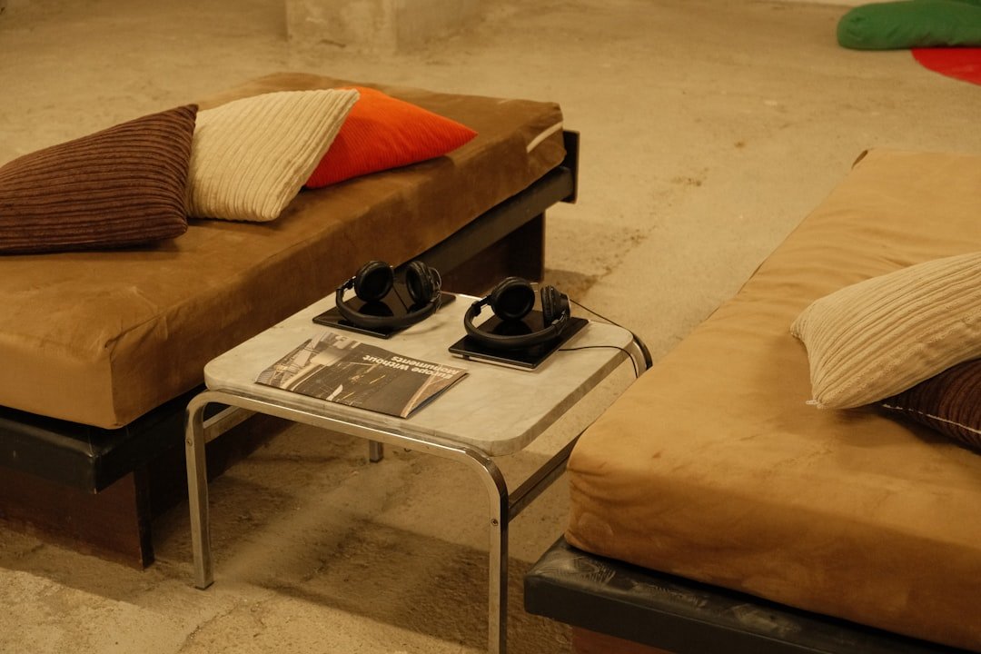 a table with headphones and glasses on it