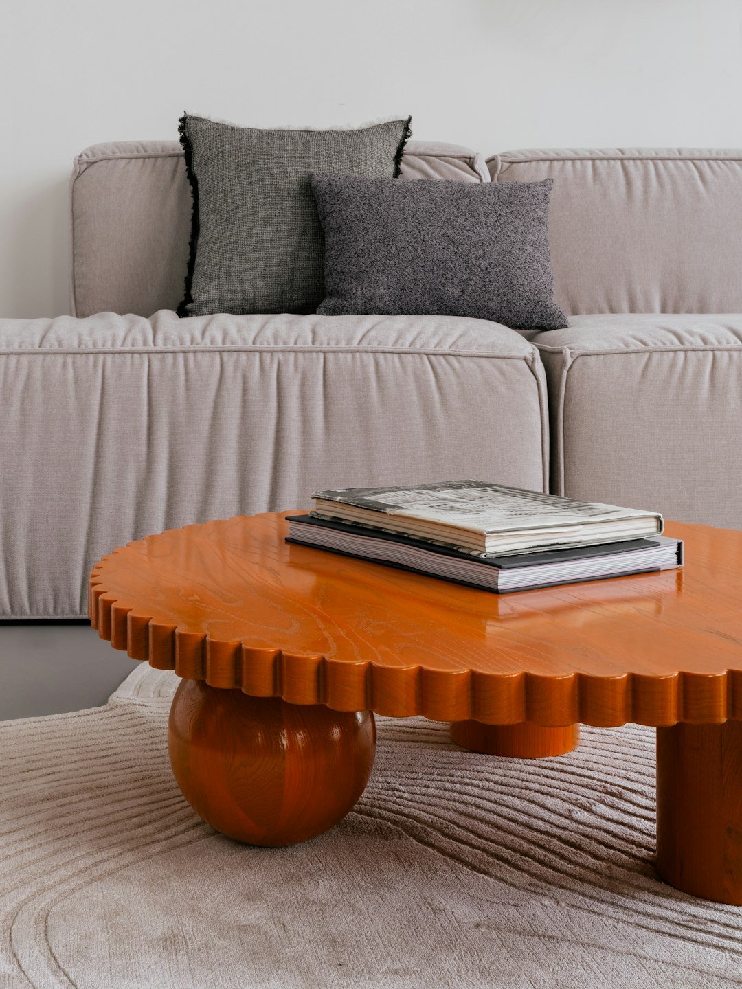 Stylish living room with a unique orange table.