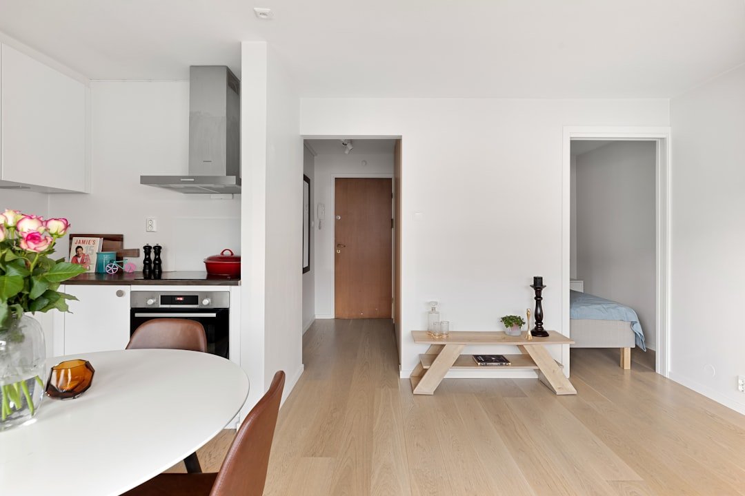 A kitchen with a table and chairs in it