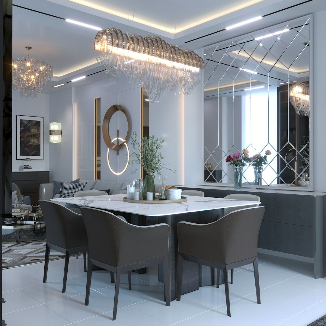 a dining room with a large chandelier over the dining table
