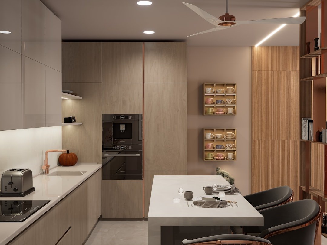 A modern kitchen with a small breakfast bar.