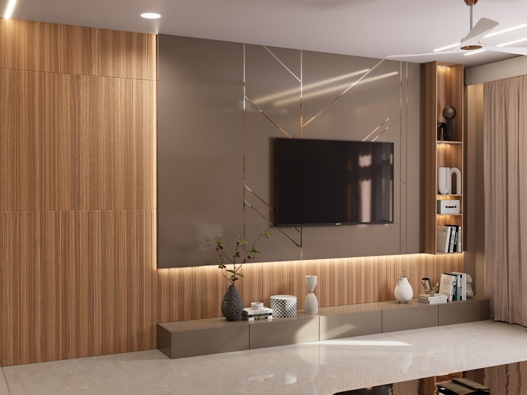 A modern living room with a mounted tv.