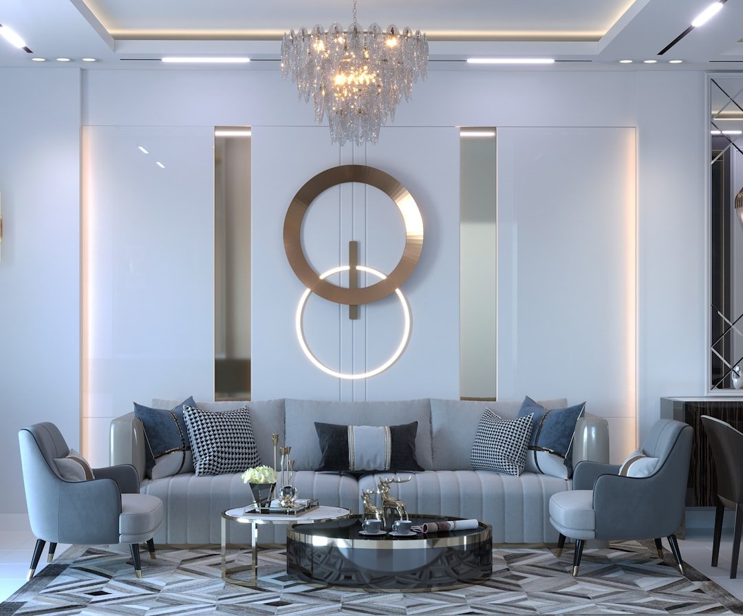 a room with a couch and chairs