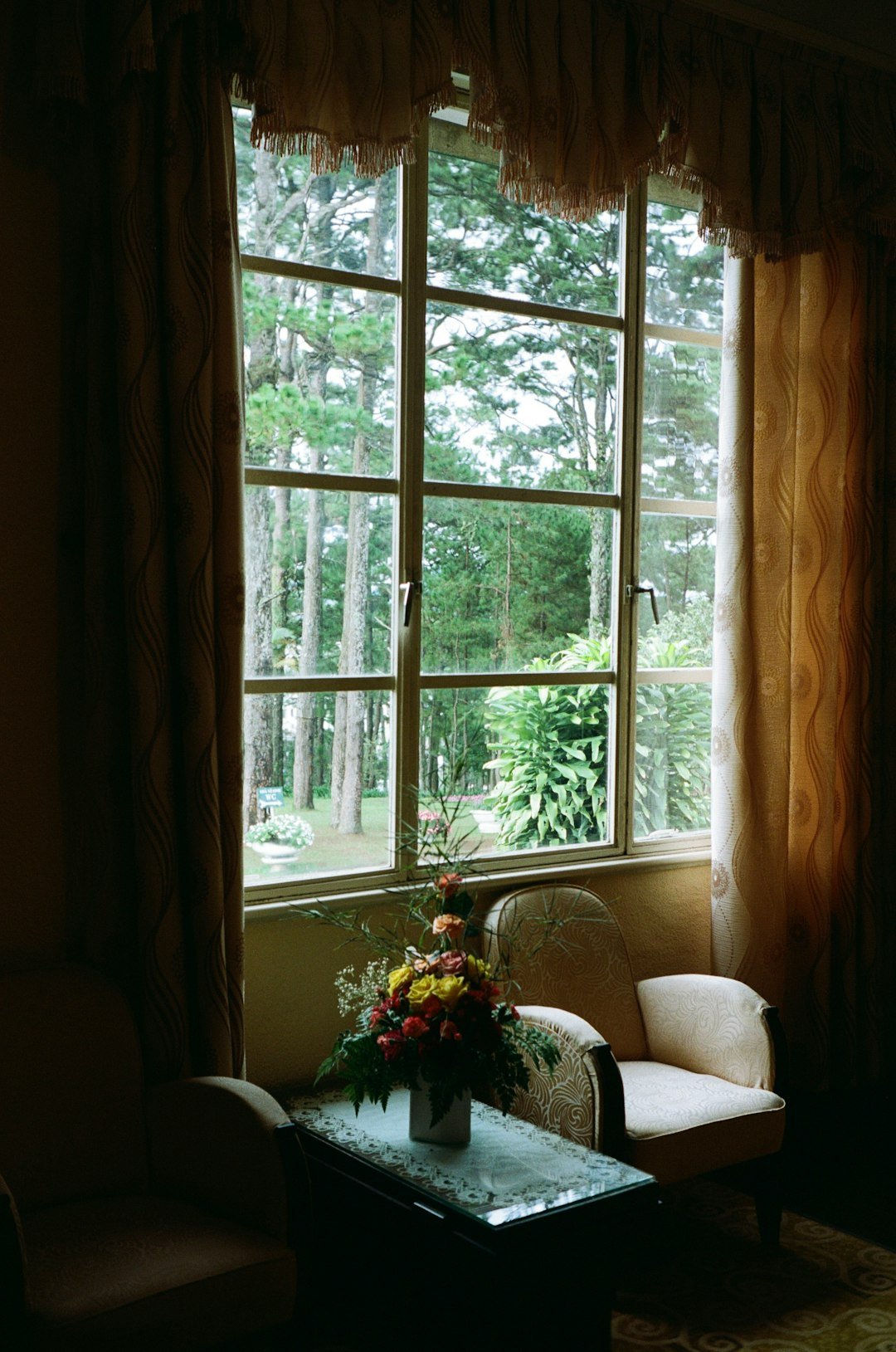 A living room filled with furniture and a window