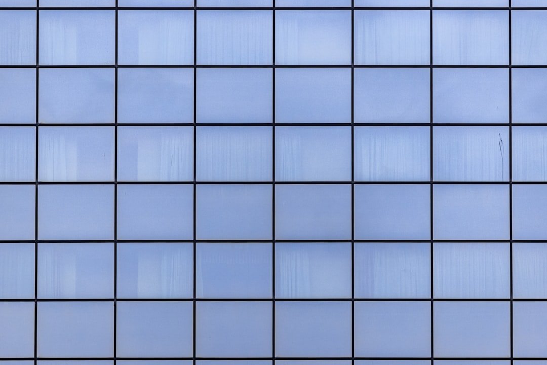 a close up view of a blue tiled wall