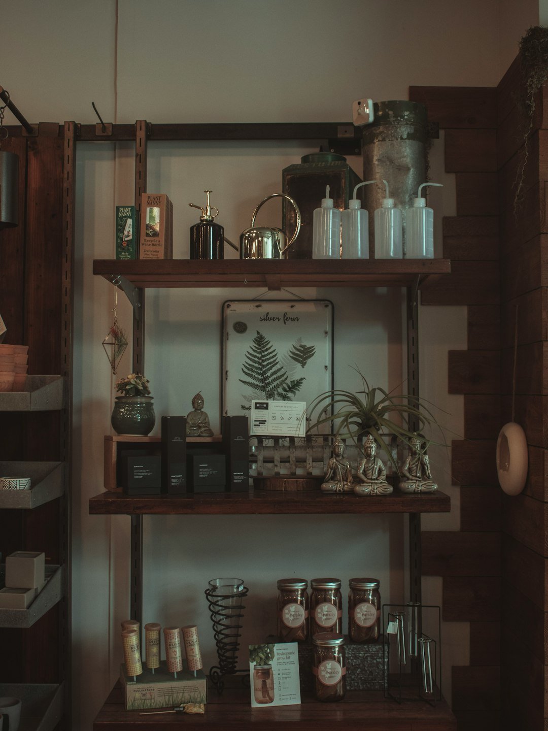 brown wooden shelf with jars and jars